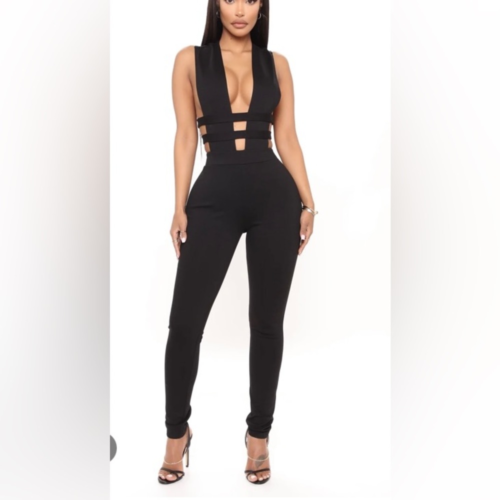 Like new! Back zip jump suit with cut outs
